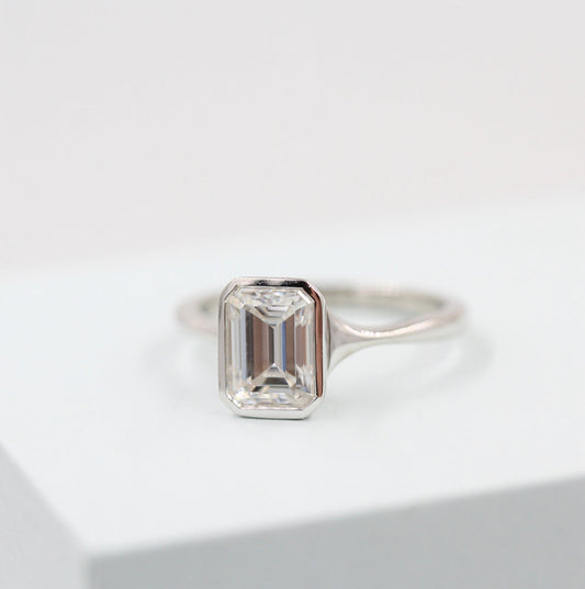Solitaire Colorless Bezel Emerald Cut Moissanite Engagement Ring