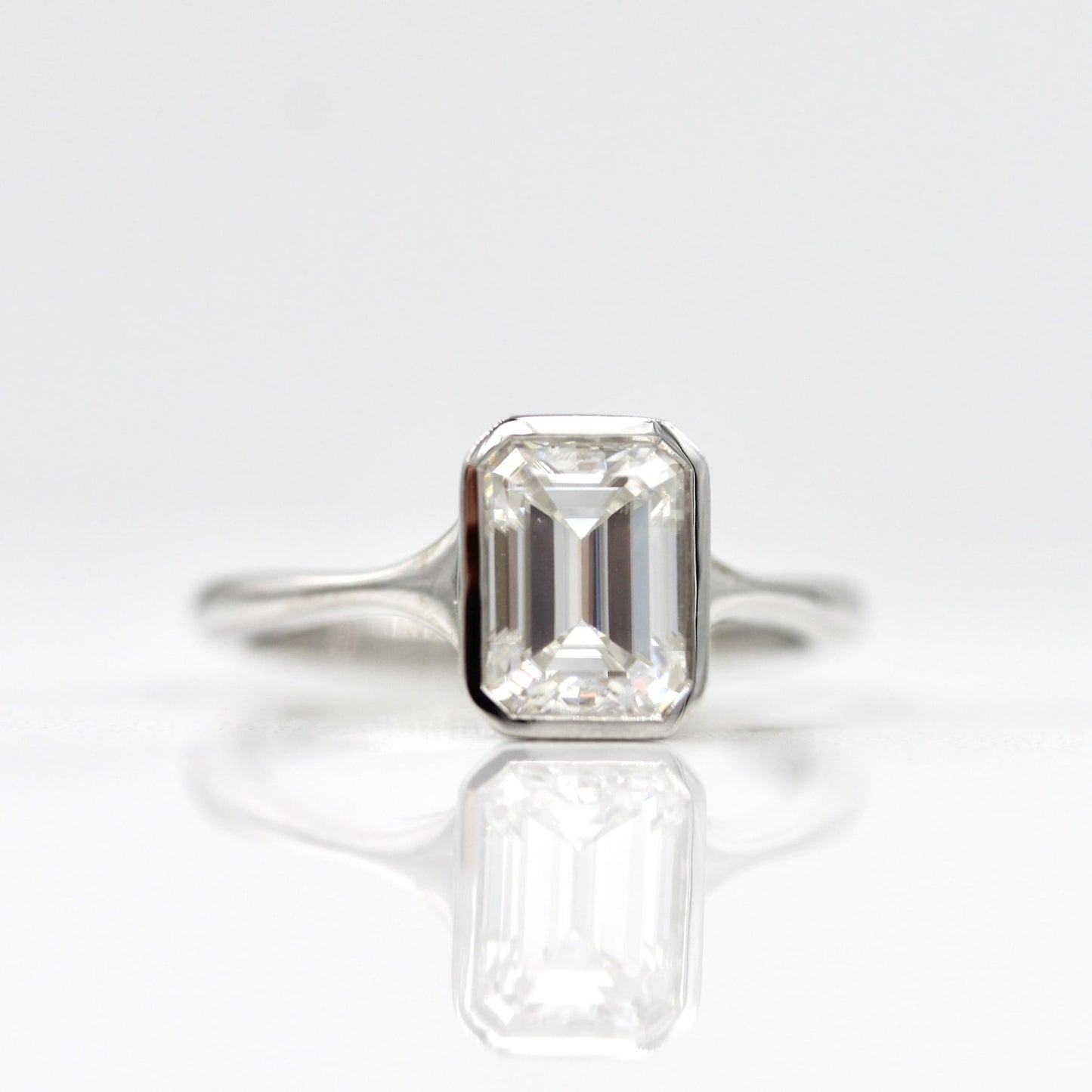 Solitaire Colorless Bezel Emerald Cut Moissanite Engagement Ring