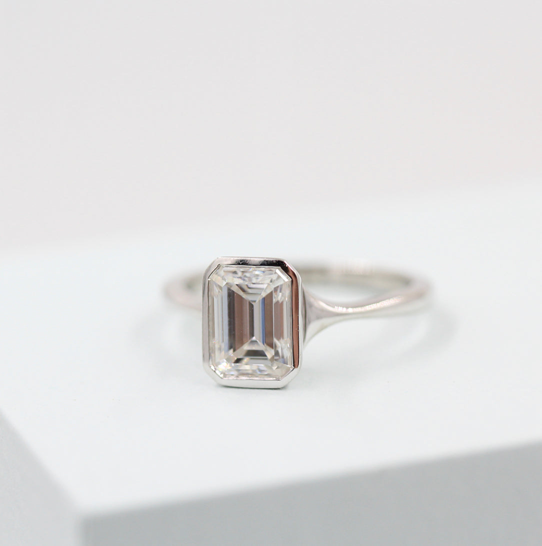 Solitaire Colorless Bezel Emerald Cut Moissanite Engagement Ring
