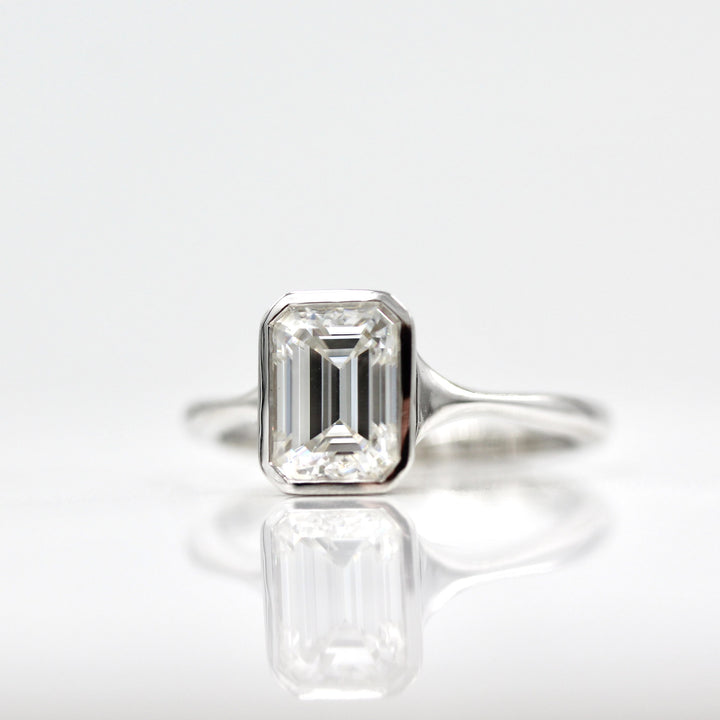 Solitaire Colorless Bezel Emerald Cut Moissanite Engagement Ring